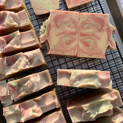 Swirl-patterned soap bars on a cooling rack